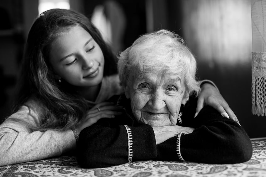 Happy granny and little girl. Black and white photo.